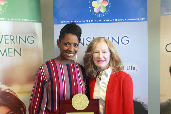Photo of Jasmine Bozeman with Cynthia Tidwell and award