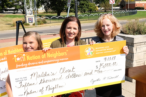 Photo of Maddie Cook, Kelly Cook, and Cynthia Tidwell with big check