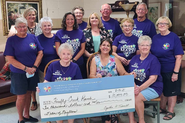 Photo of Brenda Rose and group with big check