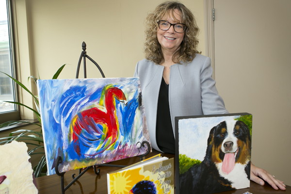 Photo of Pamela Crouch with artwork