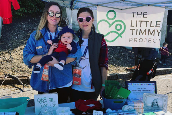 Photo of Steffany Stoeffler holding baby with Katie Kirkhoff