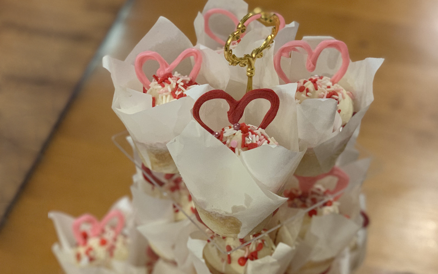 Beautifully decorated cupcakes sprinkled with love.